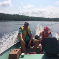 Shawn and Nathan fishing in the boat